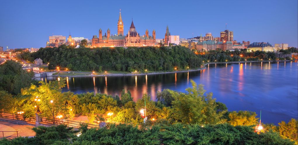 Ottawa skyline by the water at dusk